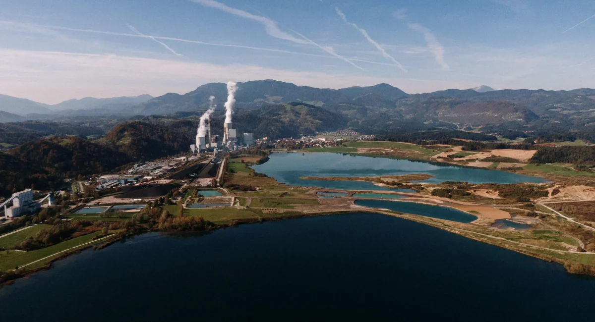 aerial-shot-landscape-surrounded-by-mountains-lakes-with-industrial-disaster_11zon