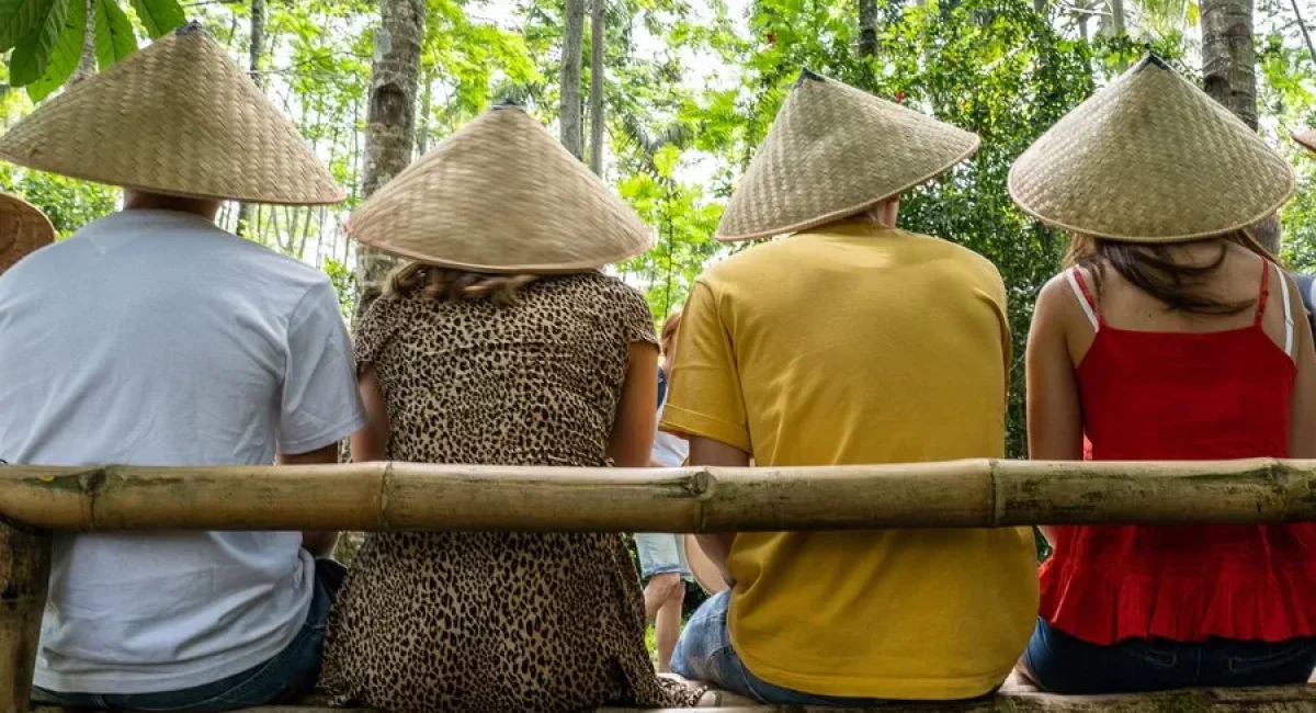 people-wearing-asian-conical-hats-while-sitting-bamboo-bench_181624-13569_11zon